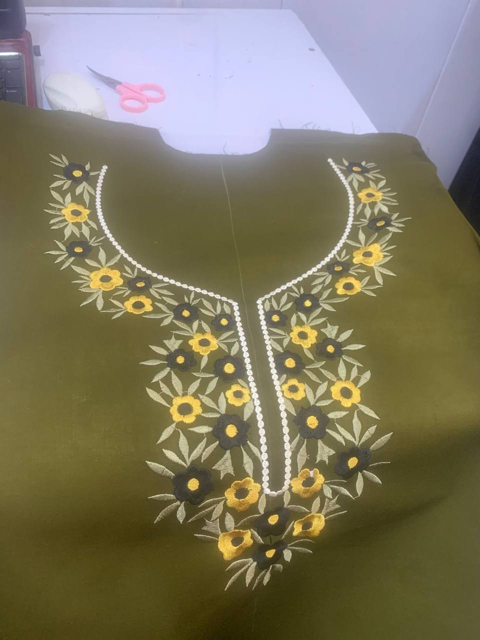 Olive green neckline with embroidered floral detail — BRIQA design